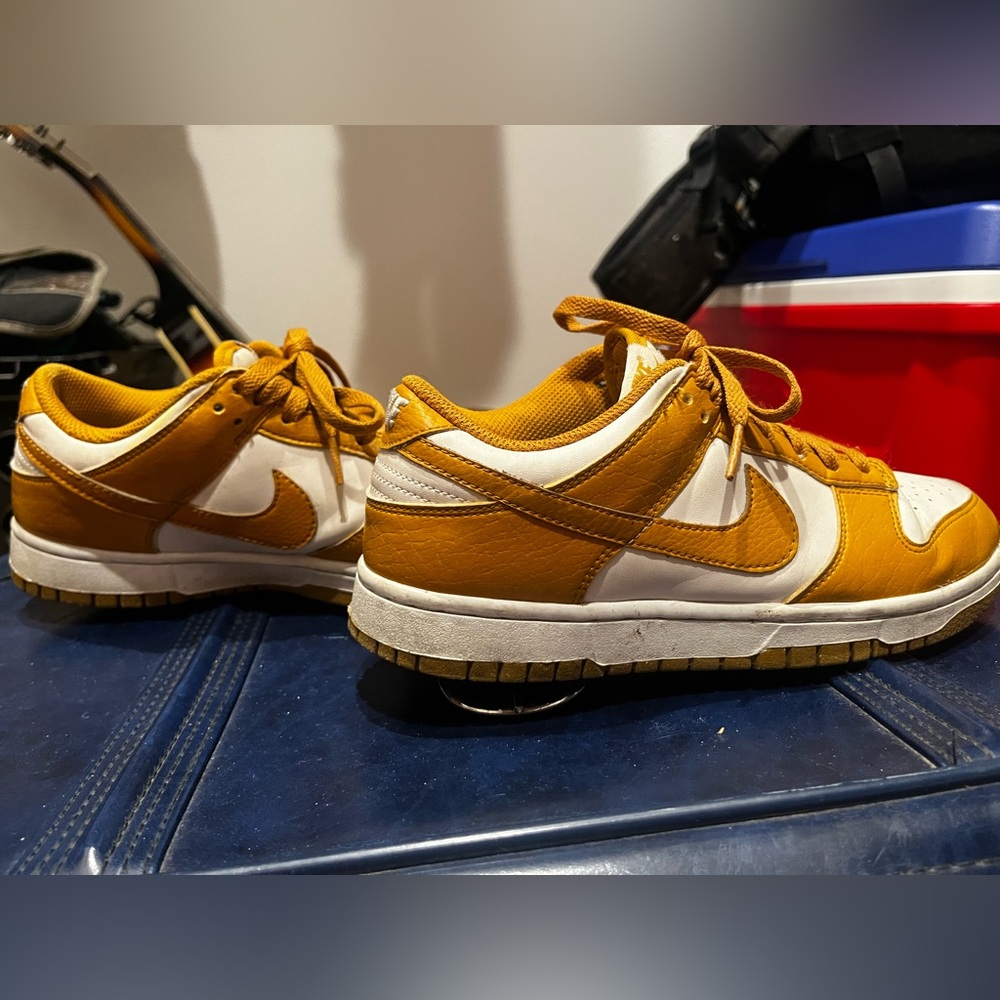 Nike dunk low in this wheat/burnt orangey color. Size 8